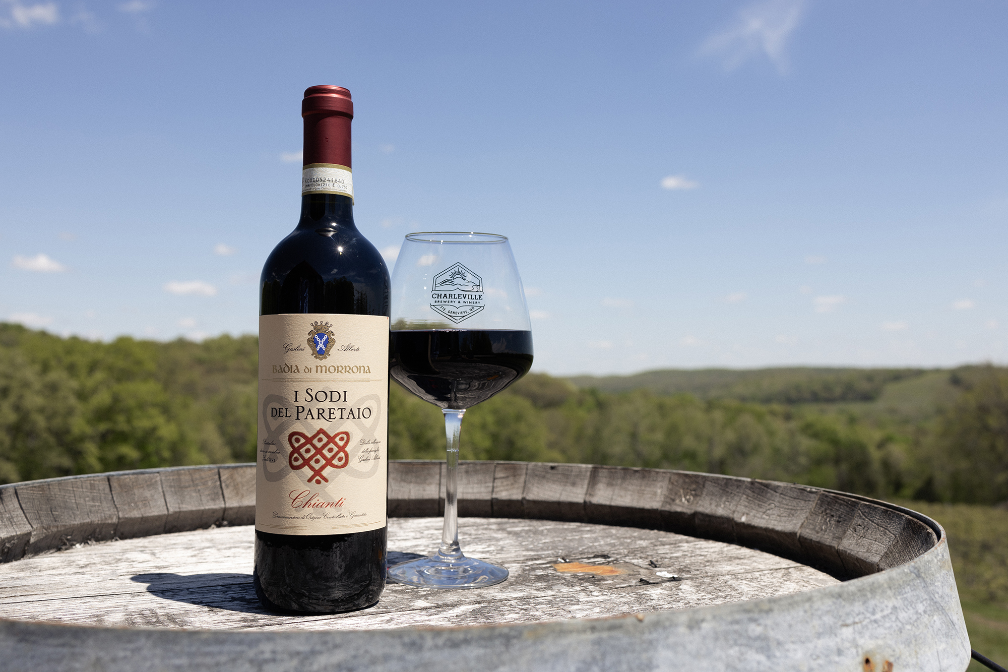 Wine tasting at Sainte Genevieve Winery in Missouri surrounded by vineyards