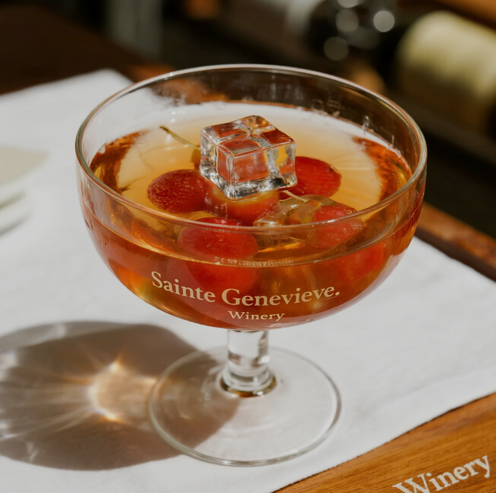 Guests enjoying a wine tasting event at Sainte Genevieve Winery